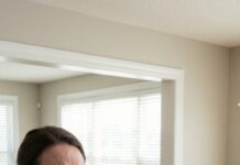 Three days after we moved in, my phone rang. “Emma?” a man whispered. “I’m the previous owner. I forgot to remove a camera… it was still connected to my phone.” My stomach dropped. “A camera—where?” His voice cracked. “I saw your husband. On your couch. With his girlfriend. While you were out with your daughter.” The front door clicked open behind me… and Mark walked in smiling.