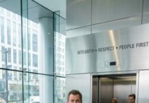 He walked into Apex Dynamics’ Seattle HQ wearing a worn coat, scuffed shoes, and a hospital wristband—then security shoved him like he was nobody. “Get out, homeless man,” someone sneered, phones already filming. Only one intern stepped forward: “Stop. He’s a human being.” Daniel calmly raised his phone. “Bring the board to the lobby. Now.” The elevator opened… and the executives bowed. What happens next will divide everyone.